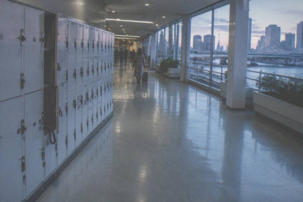 Rows of coin lockers of different sizes along a corridor at Haneda Airport